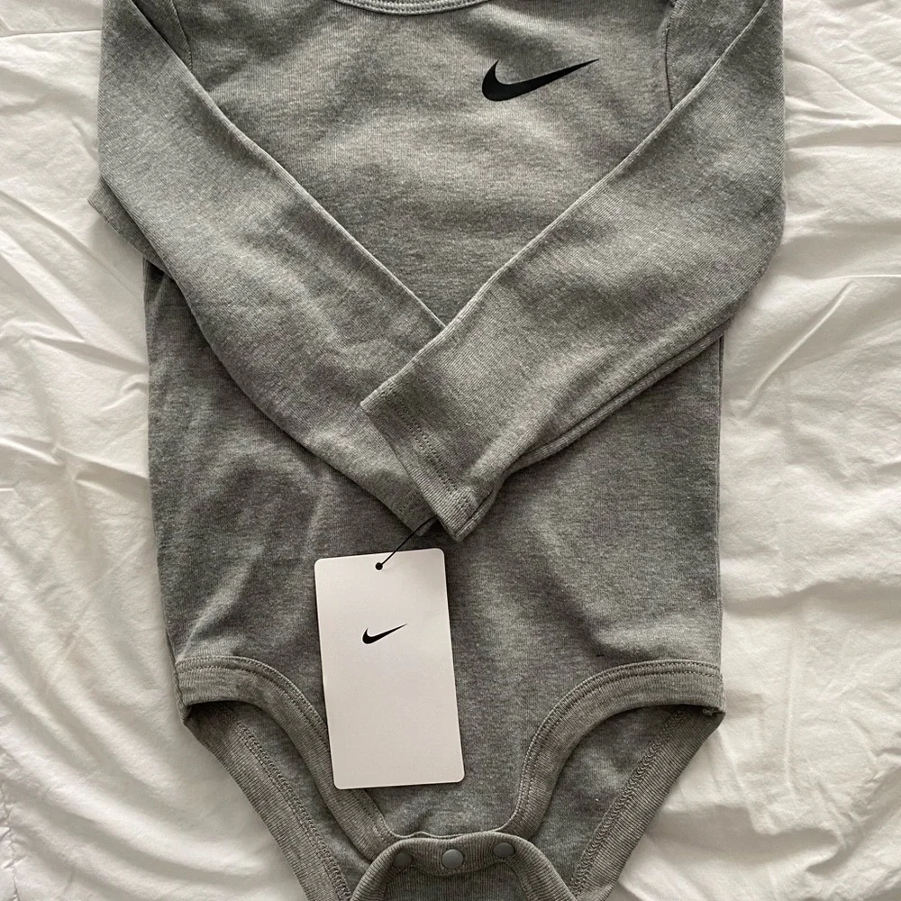Nike Gray Long Sleeve Baby Onesie